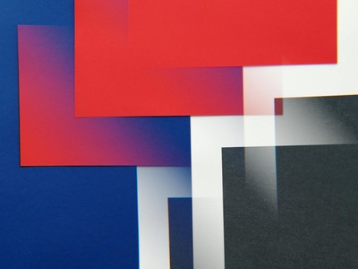 Vibrant abstract design with geometric overlays in red, blue, and black colors.