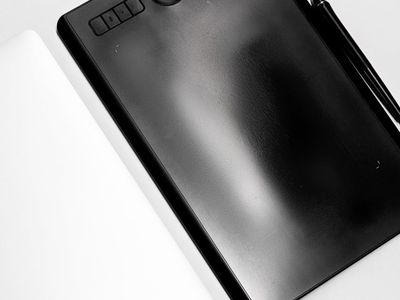 Stylus pen and graphic tablet on table